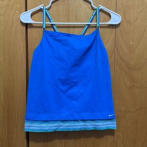 Blue Nike tank top with built in sports bra (third picture), good condition